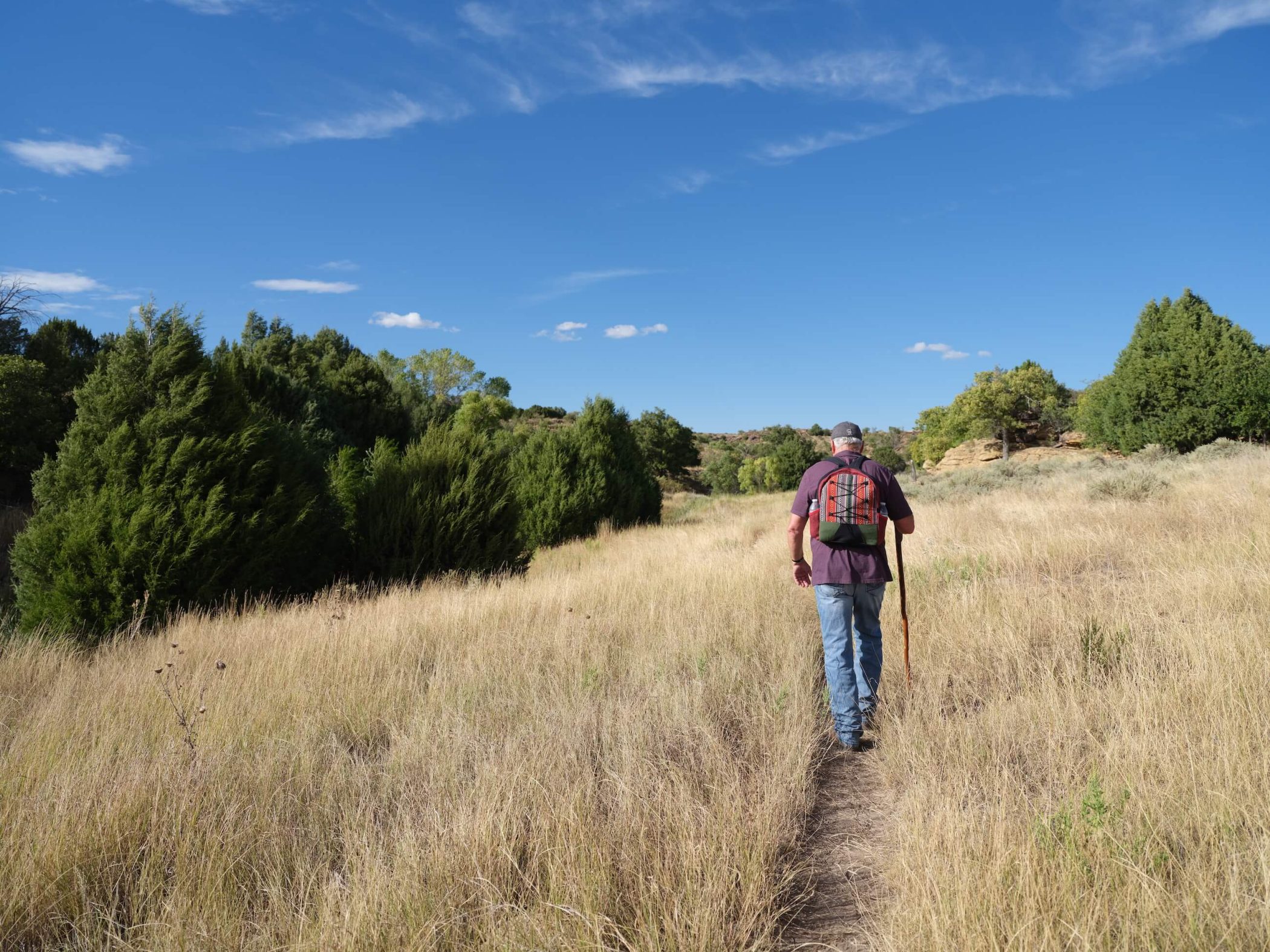 hiker on trail in canyonlands
