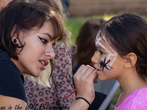 Face painting during the Tarantula Festival